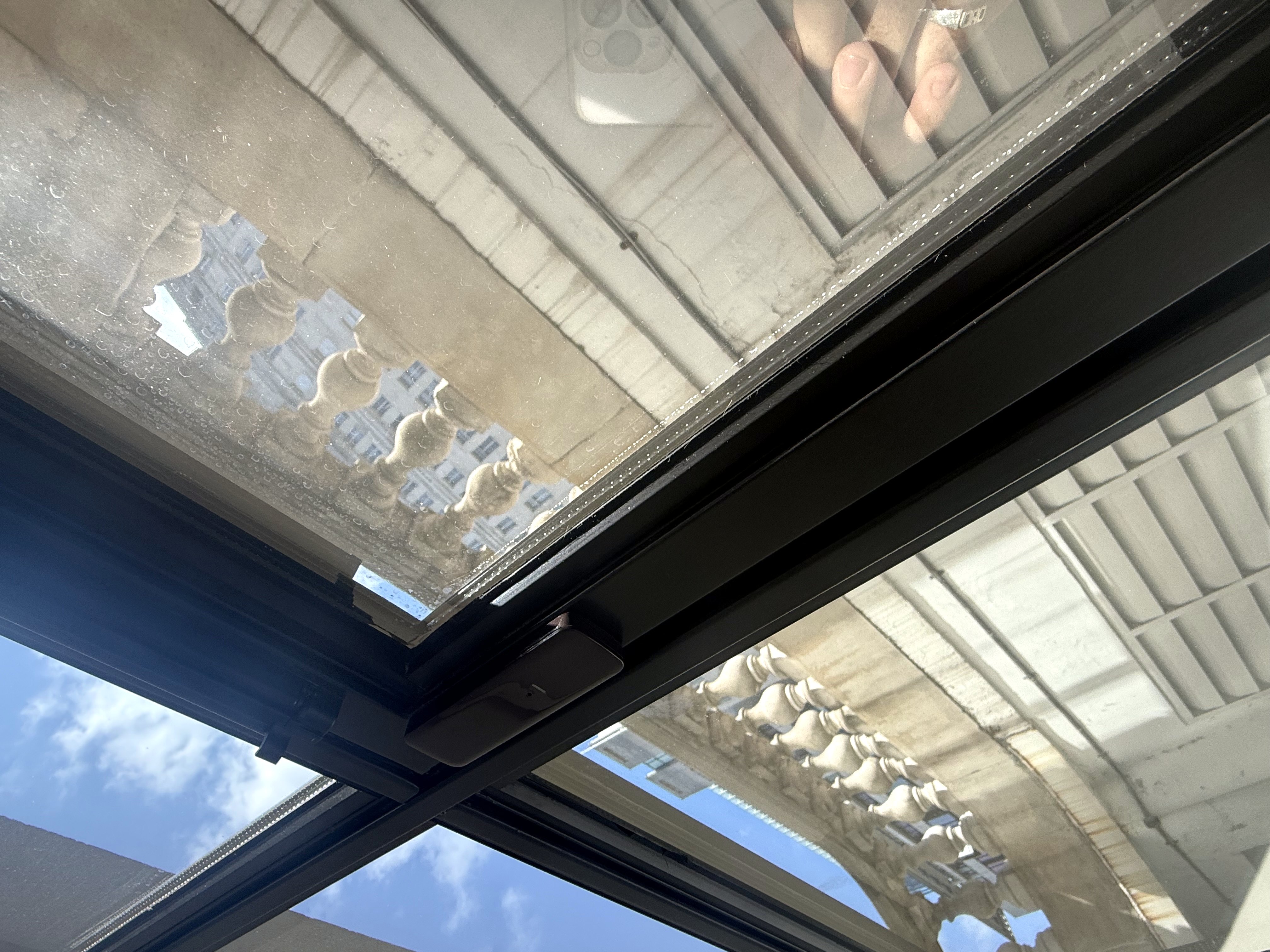 Discreet contact on an opening roof light, fitted to the frame rather than the glass.
